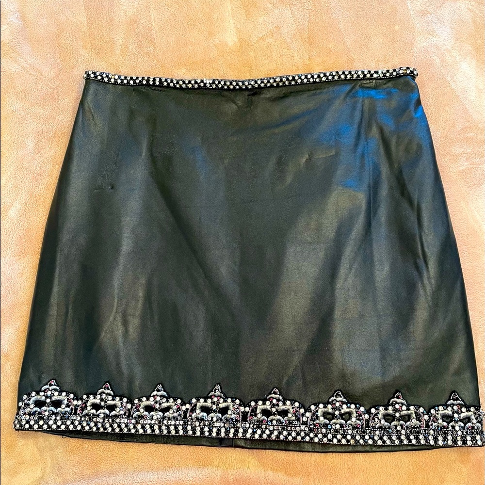 Nicole Miller black leather skirt with rhinestone waist and hem, size 8